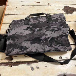 Tumi Acer Laptop bag with an abstract black and grey camo- New / never used.